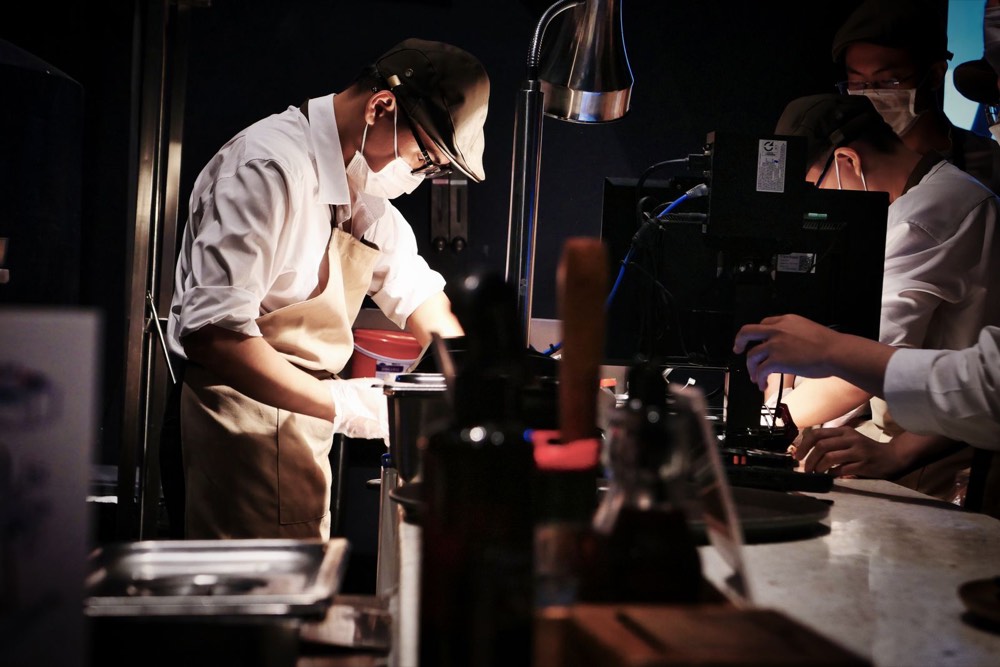 Chefs working the line in a busy restaurant kitchen